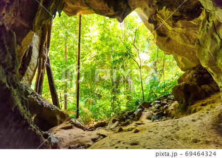 Big dark cave and sun light Big dark cave and sun light 69464324