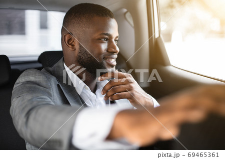 Handsome black guy manager going to office by taxi 69465361