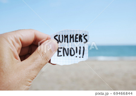 man on the beach and text summers end in a note 69466844