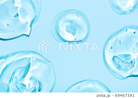 Transparent hyaluronic acid gel on a blue background. 69467391