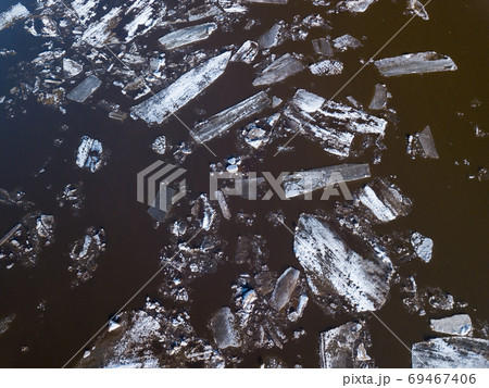 The ice floes floating on the river. The ice drift in spring time 69467406