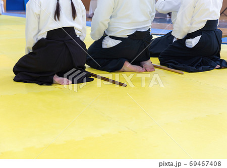 People in kimono on martial arts weapon training seminar 69467408