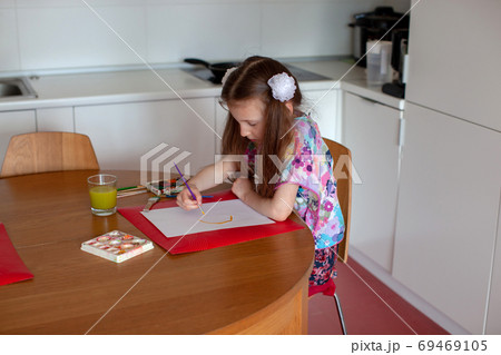 7 years old girl draws with watercolors. Close-up. 7 years old girl draws with watercolors. Close-up. 69469105
