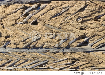 Texture of a clay wall of an old house. Background 69471644