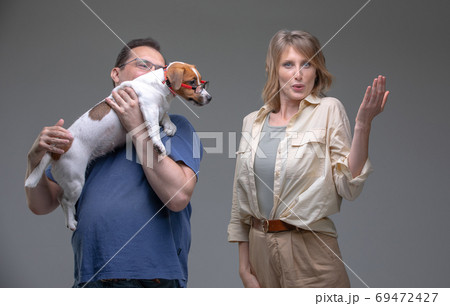 Happy family in studio with pet 69472427