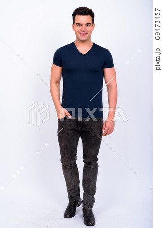 Full body shot of happy young handsome man smiling Full body shot of happy young handsome man smiling 69473457