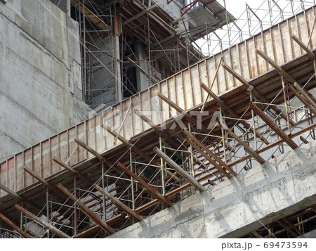 KUALA LUMPUR, MALAYSIA -OCTOBER 04, 2017: Timber formwork made from plywood and timber fabricated by workers at the construction site as the mould for a concrete structure. KUALA LUMPUR, MALAYSIA -OCTOBER 04, 2017: Timber formwork made from plywood and timber fabricated by workers at the construction site as the mould for a concrete structure. 69473594