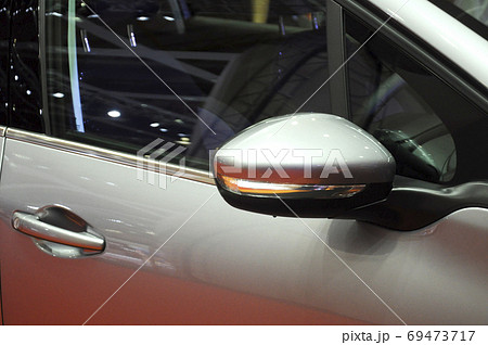KUALA LUMPUR, MALAYSIA -NOVEMBER 12, 2017: Car side mirror or door mirror build at extrior of car for the purposes of helping the driver see areas behind and to the sides of the vehicle.   69473717