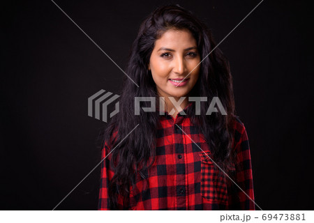 Face of happy young beautiful Indian hipster woman Face of happy young beautiful Indian hipster woman 69473881