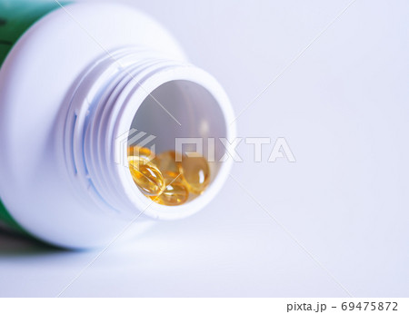 Pill spilling out of a bottle Pill spilling out of a bottle 69475872