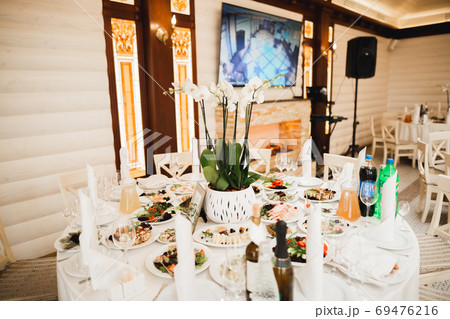 Interior of a restaurant prepared for wedding ceremony Interior of a restaurant prepared for wedding ceremony 69476216