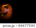 Halloween jack lantern Pumpkin On A Black Background with copyspace 69477595