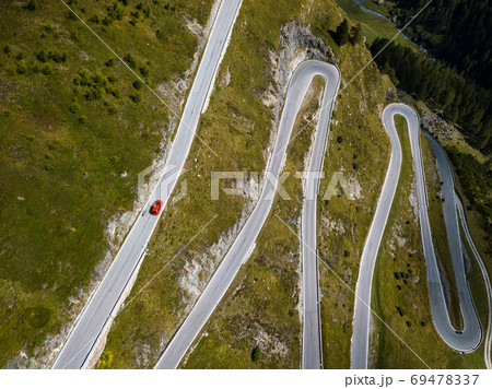 Aerial top view on scenic curvy mountain pass road to the Timmelsjoch at the border of Italy and Austria in the Alps 69478337