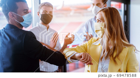 Business team closing deal by using the corona bump instead of handshake 69478588