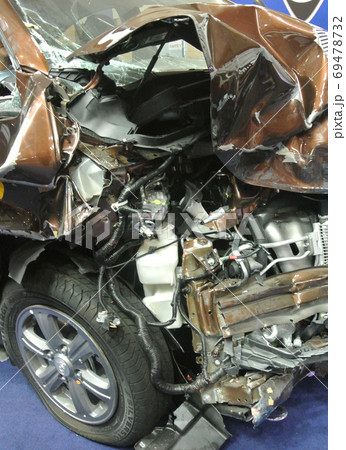 KUALA LUMPUR, MALAYSIA -NOVEMBER 11, 2017: The front of the car is badly damaged by road accidents. KUALA LUMPUR, MALAYSIA -NOVEMBER 11, 2017: The front of the car is badly damaged by road accidents. 69478732