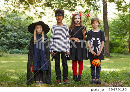 Kids Wearing Halloween Costumes Outdoors Kids Wearing Halloween Costumes Outdoors 69479186