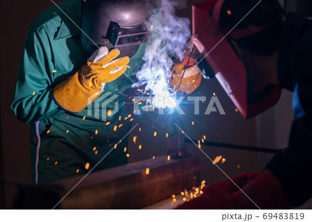 Metal welding steel works using electric arc welding machine Metal welding steel works using electric arc welding machine 69483819