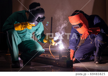 Metal welding steel works using electric arc welding machine Metal welding steel works using electric arc welding machine 69483825