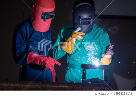 Metal welding steel works using electric arc welding machine 69483872