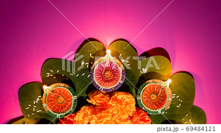 Happy Dussehra. Clay Diya lamps lit during Dussehra with yellow Happy Dussehra. Clay Diya lamps lit during Dussehra with yellow 69484121