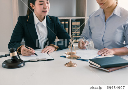 Woman judge is currently advising clients on their requests for Woman judge is currently advising clients on their requests for 69484907