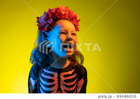 kid at party in colorful lighting 69486026