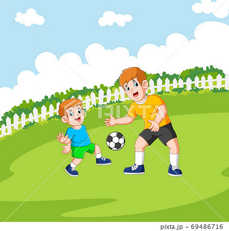 Two boys are playing the football Two boys are playing the football 69486716