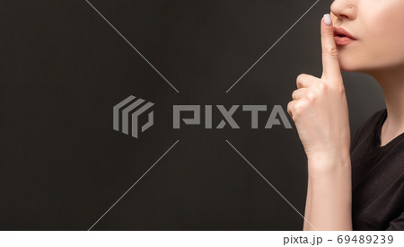 hush gesture social campaign woman showing shhhの写真素材 [69489239] - PIXTA