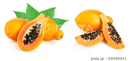 ripe cut papaya with leaves isolated on a white background 69490041