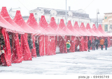 Christmas tents at the downtown fairground during a blizzard Christmas tents at the downtown fairground during a blizzard 69490749