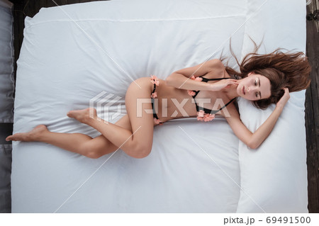 Young Woman wearing bikini enjoying her summer Young Woman wearing bikini enjoying her summer 69491500