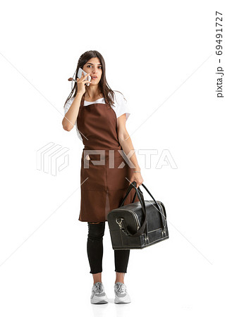 Young woman, visagiste with cosmetics isolated on white studio background Young woman, visagiste with cosmetics isolated on white studio background 69491727