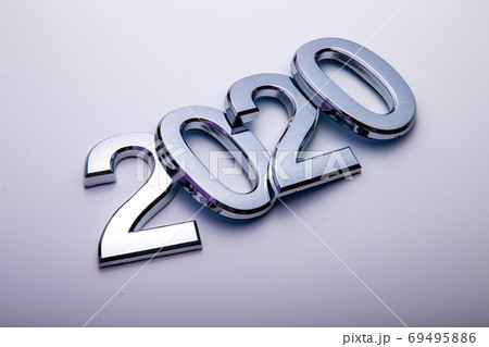 Happy New Year 2020. Symbol from number 2020 on bright background. Silver letters in the form of numbers 2020. Happy New Year 2020. Symbol from number 2020 on bright background. Silver letters in the form of numbers 2020. 69495886