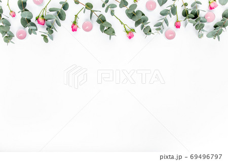 Floral pattern made of pink roses, green leaves eucalyptus, branches on white background. Flat lay, top view. Valentine's background. Floral pattern. Floral pattern made of pink roses, green leaves eucalyptus, branches on white background. Flat lay, top view. Valentine's background. Floral pattern. 69496797