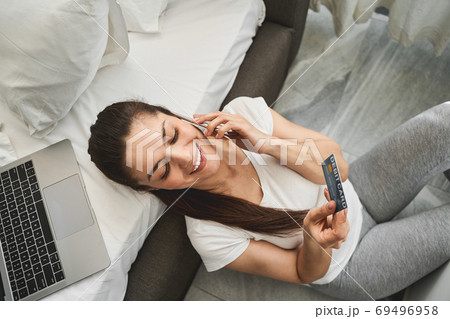 Joyful pretty lady speaking on the cellphone 69496958