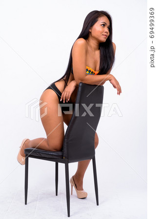 Young Asian woman wearing swimwear against white background 69499369