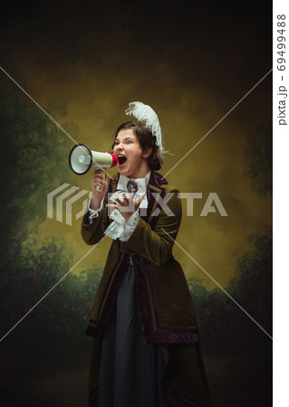 Modern trendy look, portrait of renaissance period beautiful woman. Retro style, comparison of eras concept. Modern trendy look, portrait of renaissance period beautiful woman. Retro style, comparison of eras concept. 69499488