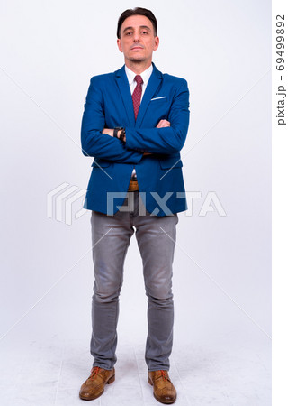 Mature handsome Italian businessman against white background Mature handsome Italian businessman against white background 69499892