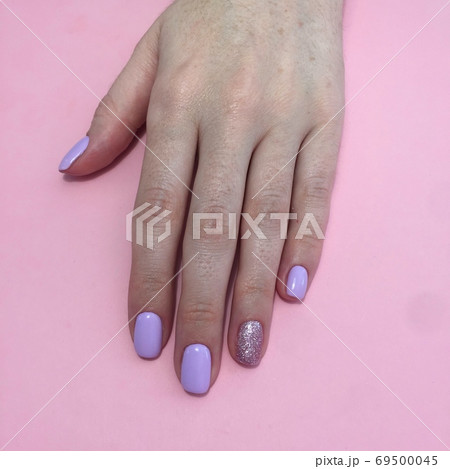 Manicure of different colors on nails. Female Manicure of different colors on nails. Female 69500045