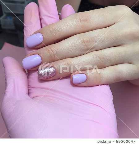 Manicure of different colors on nails. Female Manicure of different colors on nails. Female 69500047