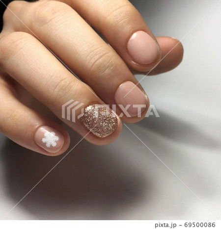 Flesh-colored beautifull manicure on nails. Female 69500086