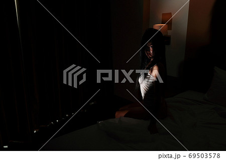 ghost woman in haunted hotel with dark filter, halloween concept 69503578