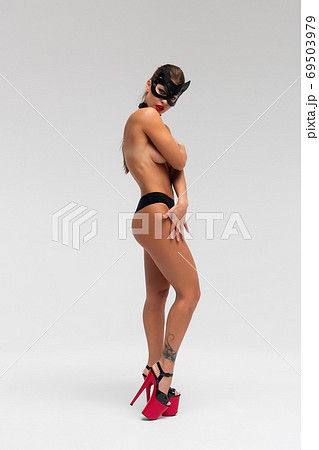 Sexy topless woman in black mask Sexy topless woman in black mask 69503979