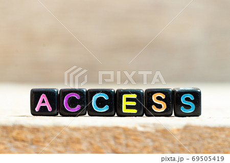 Black bead with color letter in word access on wood background Black bead with color letter in word access on wood background 69505419