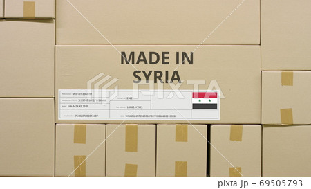 MADE IN SYRIA text and flag label on the carton in a storage MADE IN SYRIA text and flag label on the carton in a storage 69505793