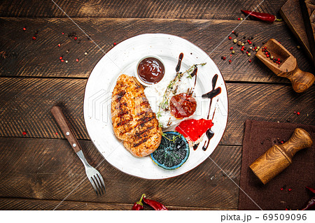 Grilled gourmet chicken fillet steak with rice Grilled gourmet chicken fillet steak with rice 69509096