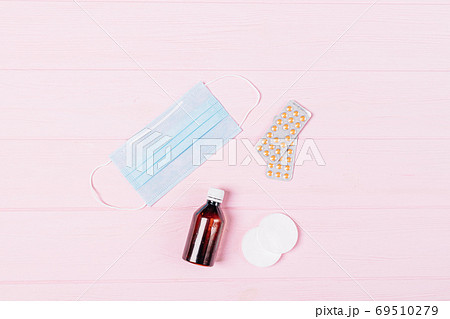 Flat lay COVID-19 prevention set with medical face mask 69510279