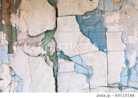 paint peels off the wall. Mill painting with a large number of layers of old paint paint peels off the wall. Mill painting with a large number of layers of old paint 69510588