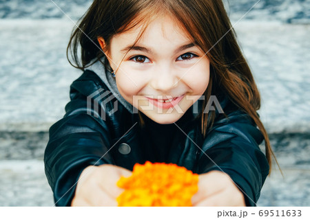 Little happy girl in urban background Little happy girl in urban background 69511633