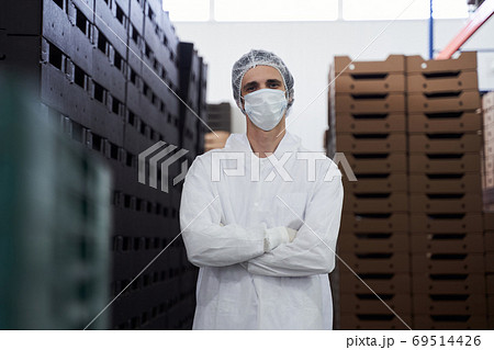 Young warehouse worker posing for the camera 69514426
